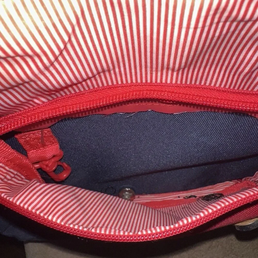 Herschel backpack with pocket. One button is missing, kept it in the front zip.